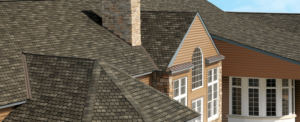 View of a home from above, featuring a beautiful shingled roof